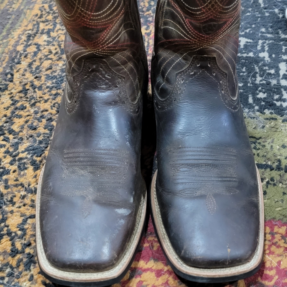 Dark brown with brown and some red stitching on shaft. No damage either boots